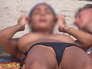 Playing with big tits on beach Picture 7