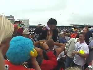 Happy lady flashes her tits to the crowd Picture 2