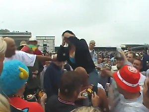 Happy lady flashes her tits to the crowd Picture 8