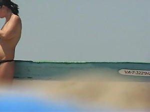 Topless babe lights a cigarette Picture 6