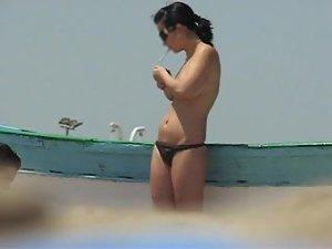 Topless babe lights a cigarette Picture 8