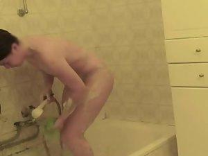 Teenage girl bent over a bath tub Picture 7