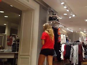 Fit girl waits in line to try some new clothes Picture 7