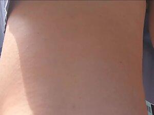 Bubble butt keeps showing itself in upskirt of fluffy skirt Picture 1