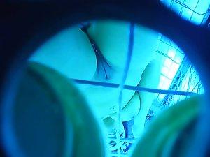 Peeping on shaved pussy and big tits in tanning machine