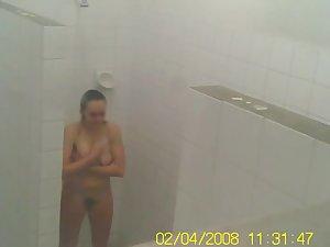 Voyeur spies a teen girl showering Picture 5