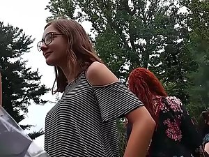 Cute girl with glasses keeps fixing her wedgie