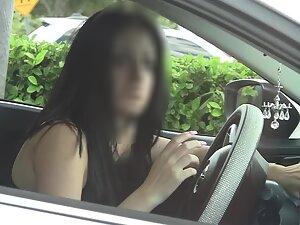 Nice boobs of a cute but suspicious girl in car Picture 1