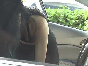 Nice boobs of a cute but suspicious girl in car Picture 7