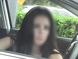 Nice boobs of a cute but suspicious girl in car