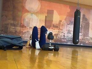 Flexible girl interrupts her workout with texting Picture 7