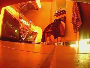 Chubby girl wipes sweat after tanning Picture 1