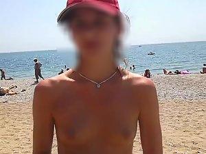 Topless video blogger at the beach Picture 4