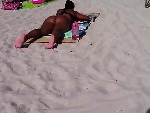 Dark tanned girl in a thong bikini Picture 4