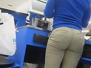 Hot butt of a cash register lady is filmed