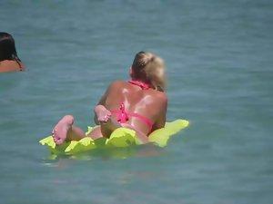 Pale buttocks in a pink thong bikini Picture 2