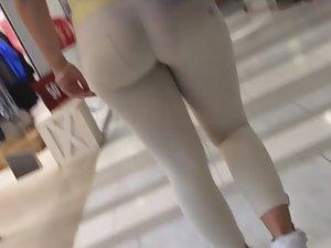 Voyeur follows a fine thick ass in tight white pants Picture 8