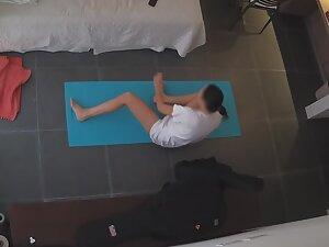 Peeping on woman doing half naked yoga exercises Picture 3