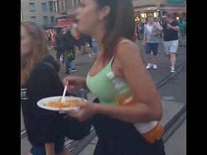 Checking her big tits while she eats at road curb Picture 2