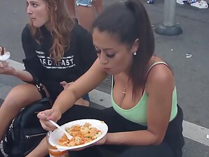 Checking her big tits while she eats at road curb