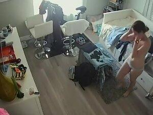 Spying on sweet girl changing clothes in her small apartment Picture 2