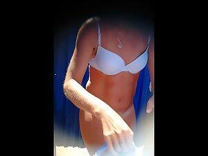 Voyeur peeps on fuckable fit milf in the beach cabin Picture 4