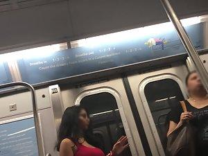 Seductive look of curvy girl in subway train Picture 1