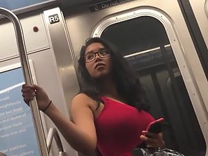 Seductive look of curvy girl in subway train