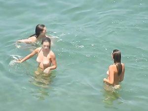 Nudist girls enjoying a long swim Picture 5