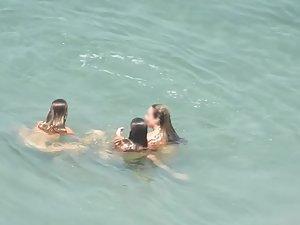 Nudist girls enjoying a long swim Picture 6