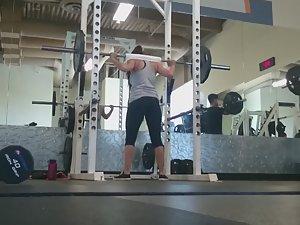 Fit girl squats in the gym Picture 2