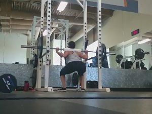 Fit girl squats in the gym Picture 3