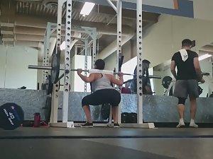 Fit girl squats in the gym Picture 4