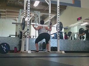 Fit girl squats in the gym Picture 5