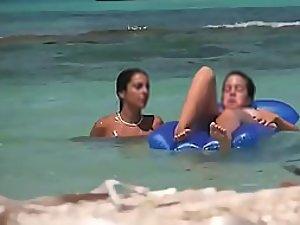 Topless teens having fun in the water