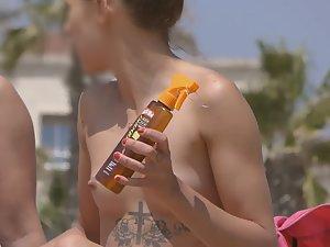 Sexy tattoo on tiny topless babe Picture 1