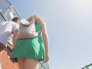 Upskirt of teen girl in green dress Picture 4