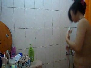 Fuckable asian girl peeped in the shower Picture 2