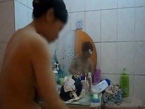 Fuckable asian girl peeped in the shower Picture 7