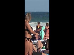 Voyeur zoom on hot cameltoe in black bikini Picture 7