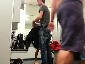Hipster couple undressing in unisex locker room Picture 1