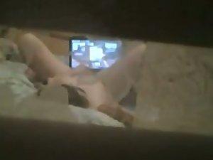 Peeping as she rubs her wet pussy