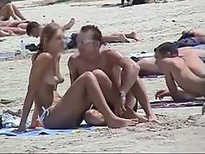 Topless hunt on the beach