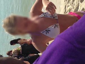 Funny girl shows her small tits to guys on beach Picture 5