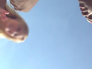 Funny girl shows her small tits to guys on beach Picture 6