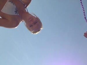 Funny girl shows her small tits to guys on beach Picture 7