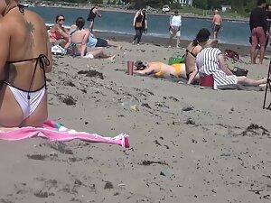 Checking out a hot group of friends on the beach from all sides