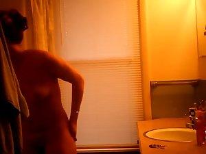 Hidden camera caught nude girl before shower Picture 2