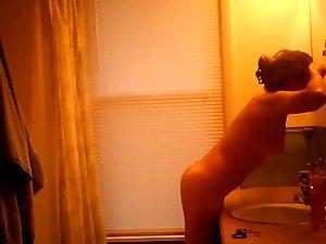 Hidden camera caught nude girl before shower Picture 3