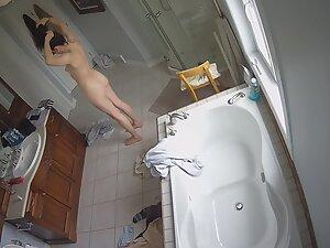 Spying on fit girl getting naked for a shower Picture 3